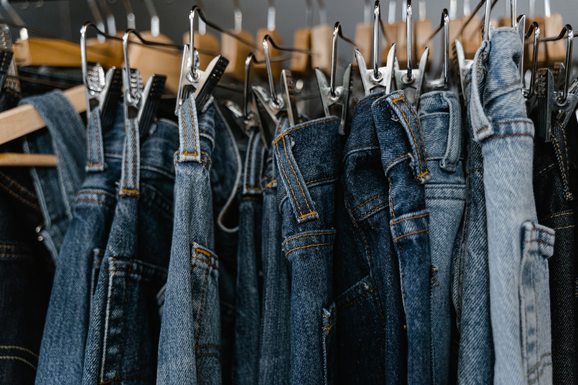 Trousers & jeans displayed on clothing hangers